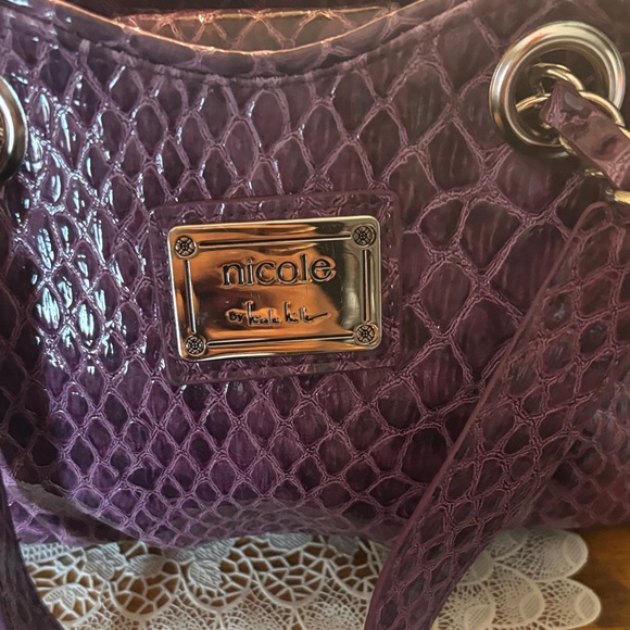 Nicole Miller Crocodile Purple Small Bag ..
Width 10
Length 7 - Picture 2 of 6